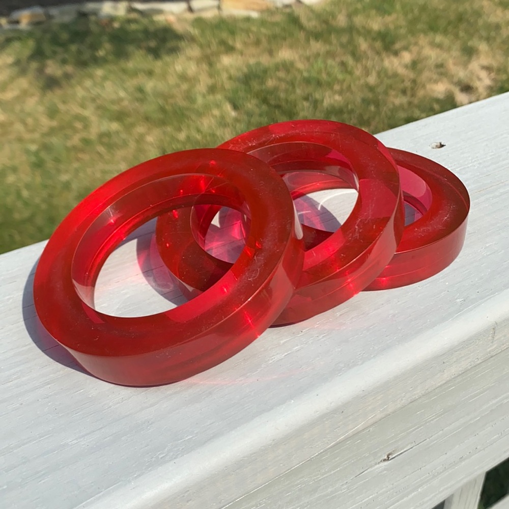 Set of three pink lucite bangles
